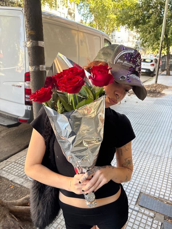 Woman with red roses spotted on Buenos Aires street Valentine's Day