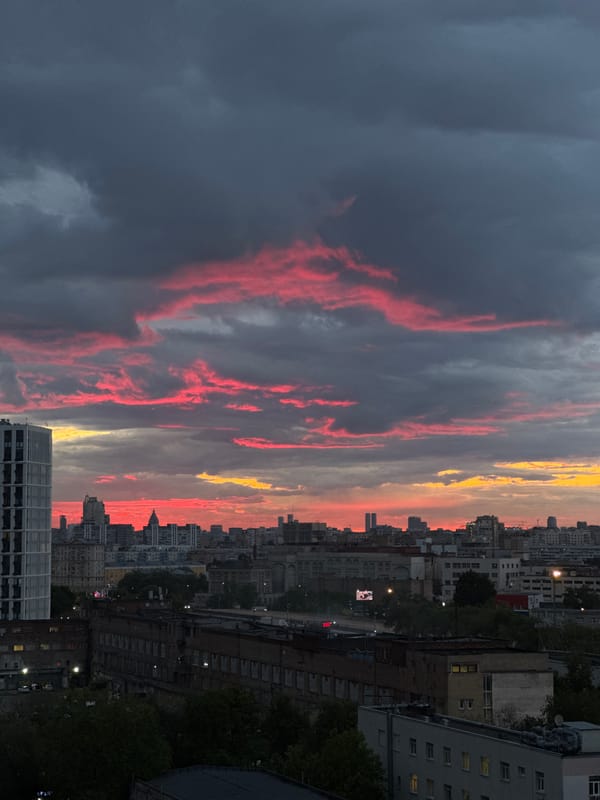 Dramatic sunset illuminates Moscow skyline with vibrant colors