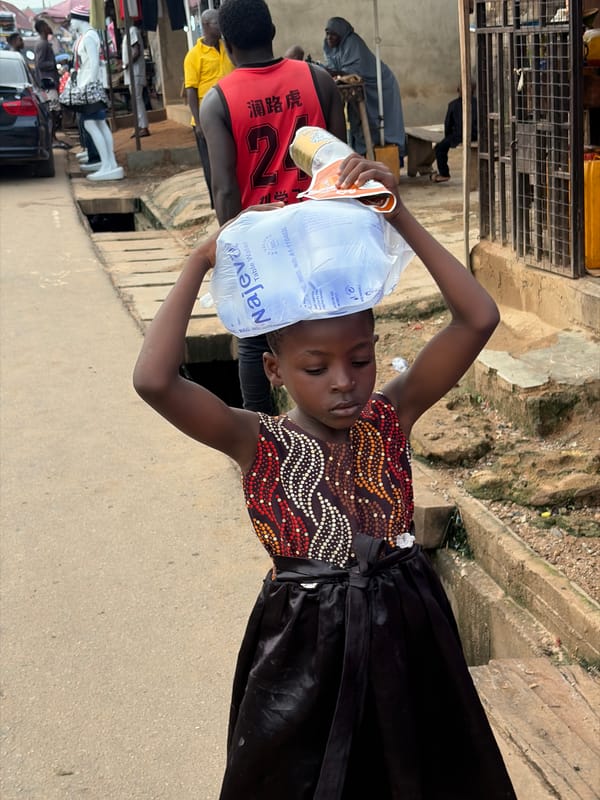 Street life and commerce along a Sabojibi, Nigeria market strip