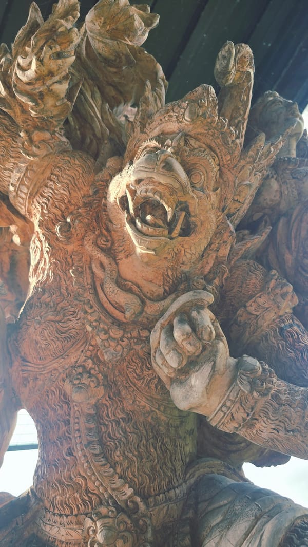 Traditional Balinese stone carvings documented in Payangan, Indonesia