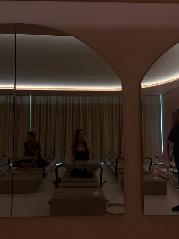 Woman exercises on Pilates reformer in Mexico City studio
