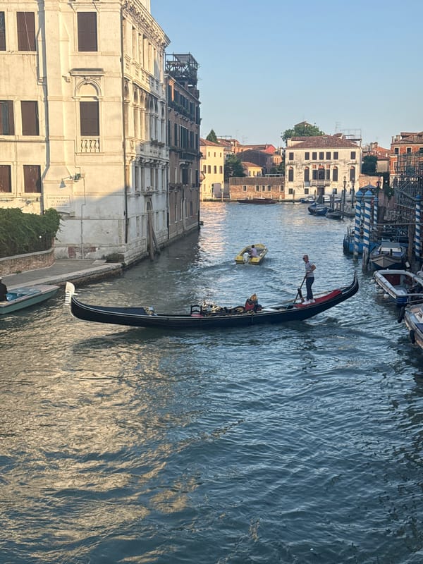 Evening boat traffic observed in Venice canals at sunset