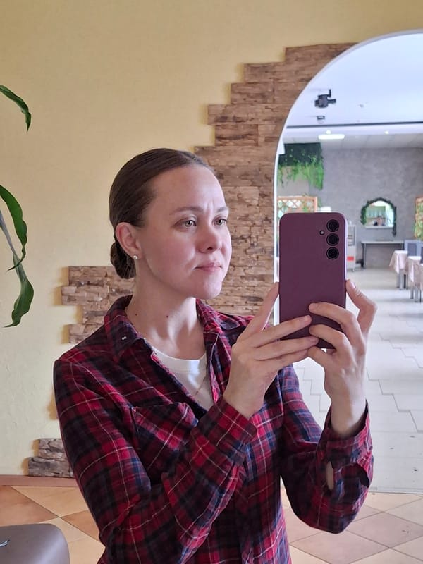 Woman takes selfie with purple phone in Sarapul