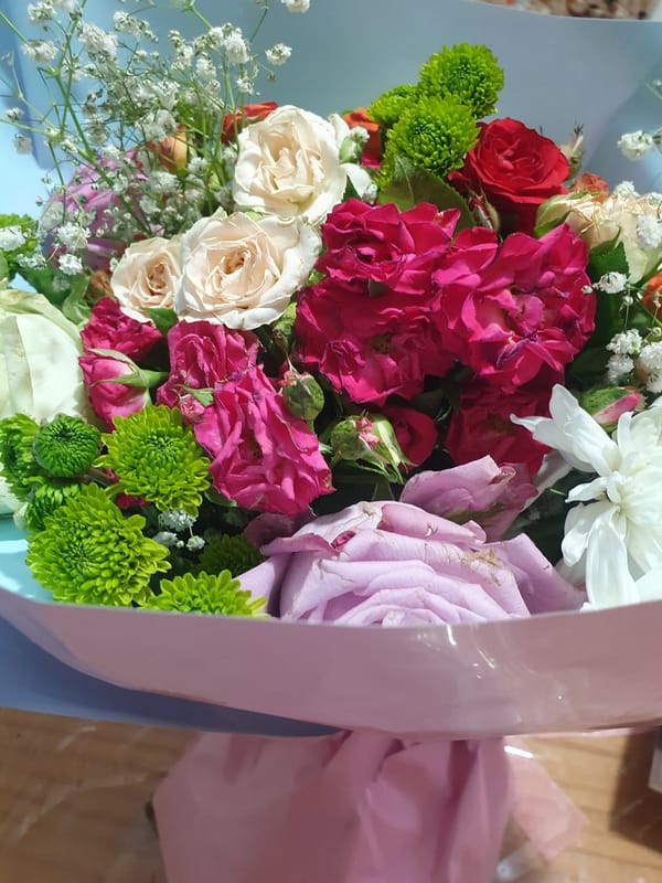 Mixed rose bouquet photographed up close from multiple angles
