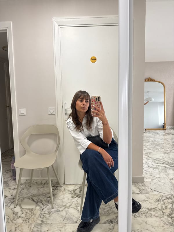 Woman takes selfie in white chair, Cannes France