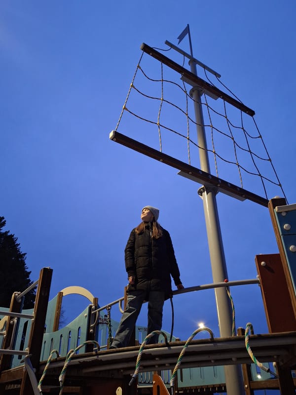 Woman explores ship-themed playground equipment in Chaikovsky, Russia