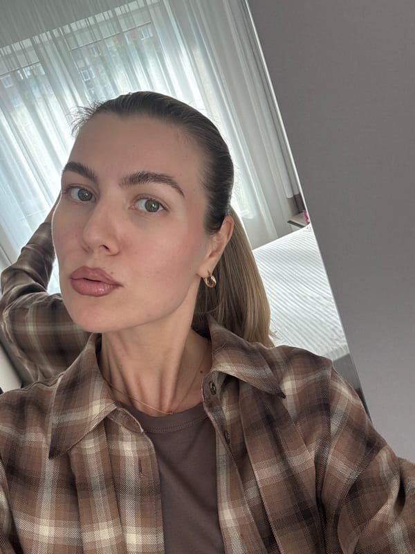 Bedroom selfie session with white tulips and a yellow phone