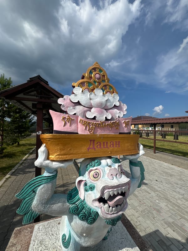 Buddhist temple complex above Ulan-Ude, prayer flags and city views