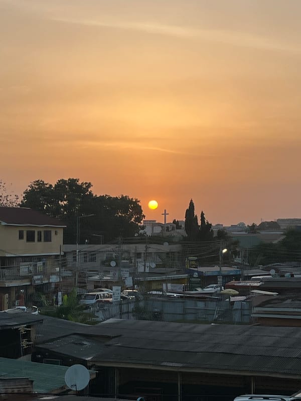 Urban sunset captured in Accra shows hazy atmosphere