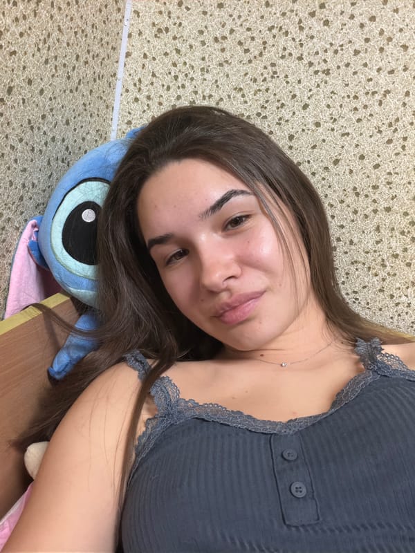Woman resting at home with stuffed animals in Sofia