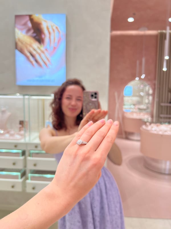 Diamond engagement ring shown off in a jewelry store