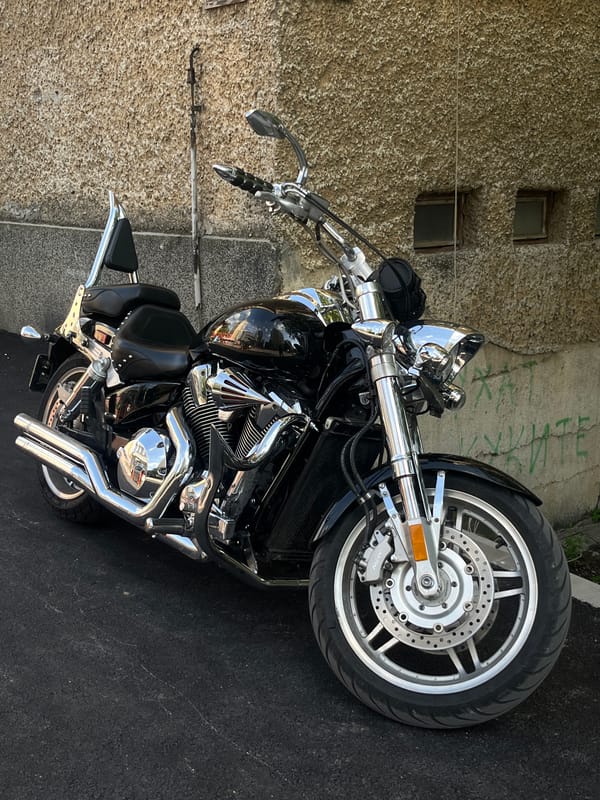 Motorcycle parked near old building in Gabrovo, Bulgaria