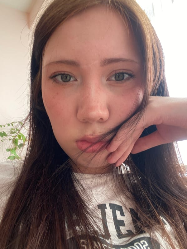 Woman Takes Morning Selfies in Graphic T-Shirt