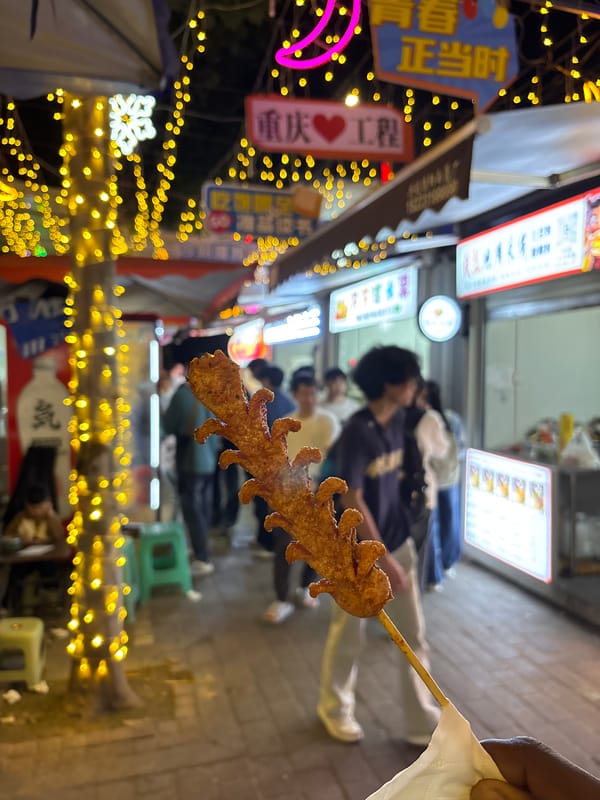 Evening street food market activity documented in Jiangjin, China