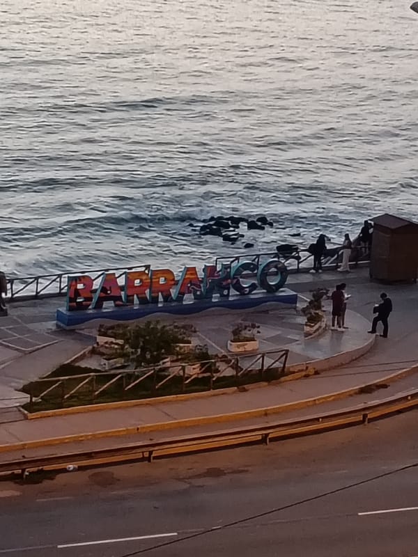 Tourist captures Barranco's street art and landmarks during evening walk