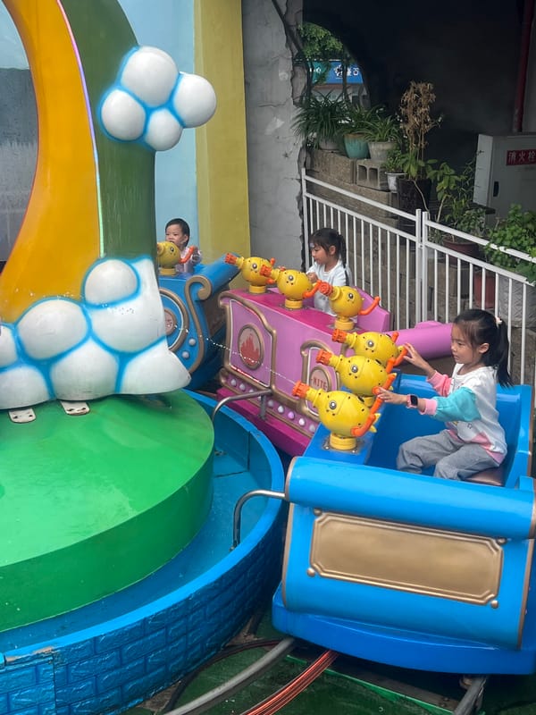 Amusement park rides operate during morning hours in Nan'an District
