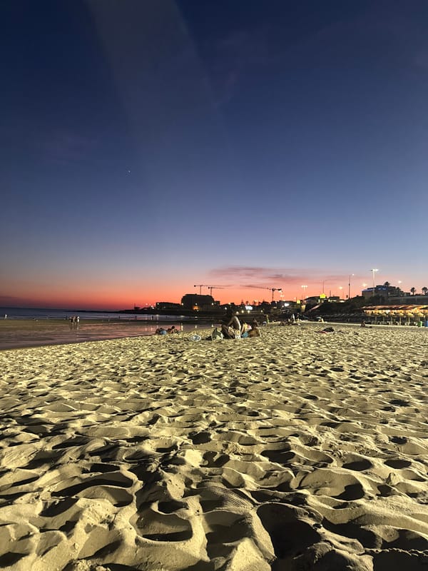 Cascais beach at twilight, sky fading orange and pink