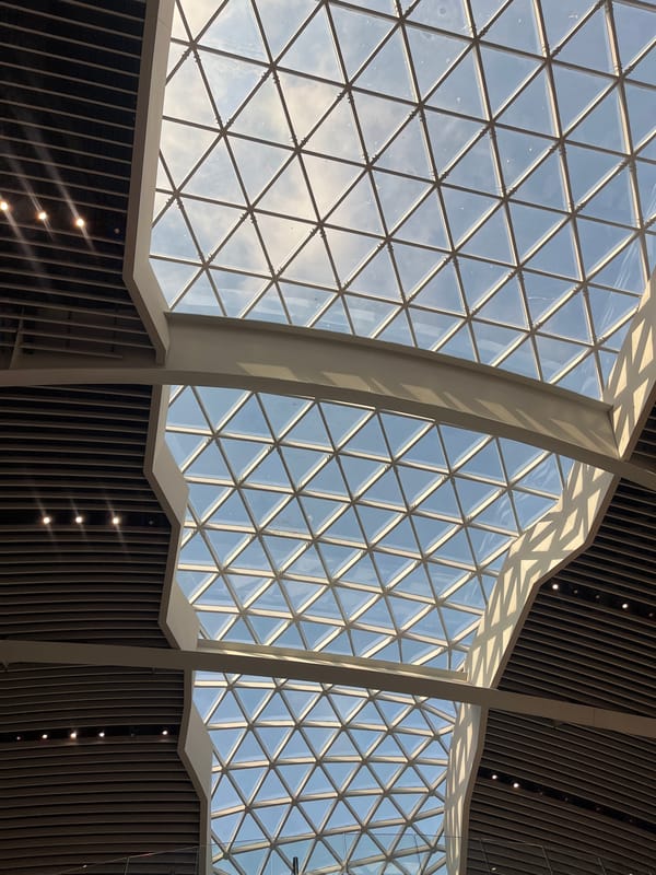 Curved glass ceiling architecture documented in Fiumicino, Italy