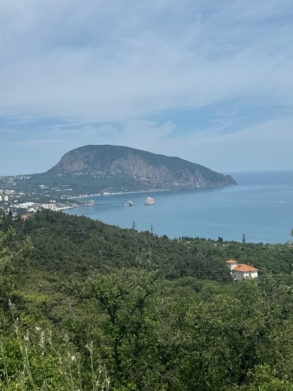 Tourist captures scenic moments in Gurzuf's mountainous coastal landscape