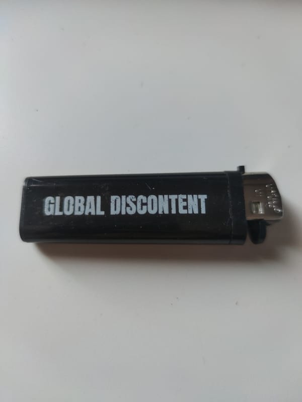 Collection of themed lighters documented on white surface