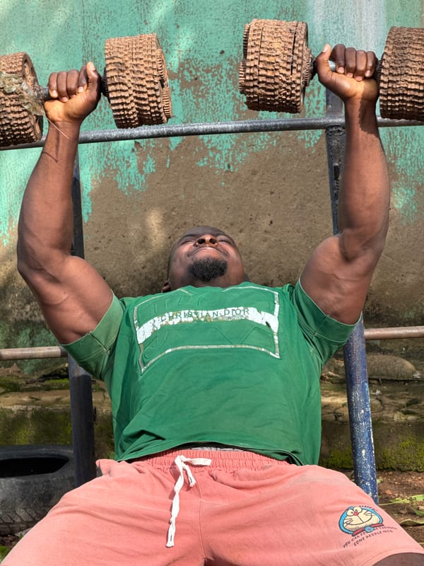 DIY outdoor gym in Akwanga, Nigeria — improvised weights, real effort