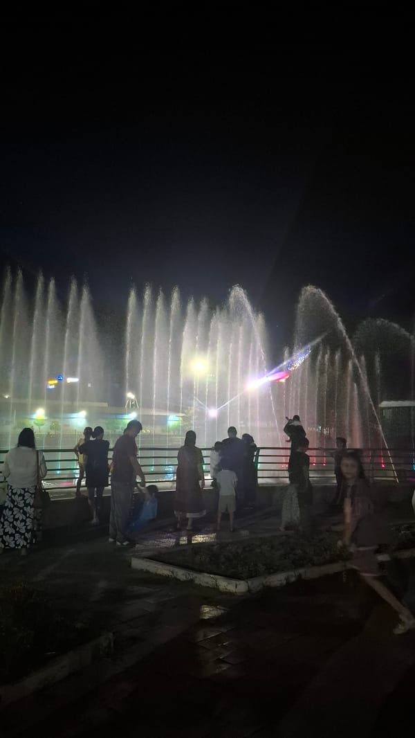 Evening crowd watches musical fountain light show in Shymkent