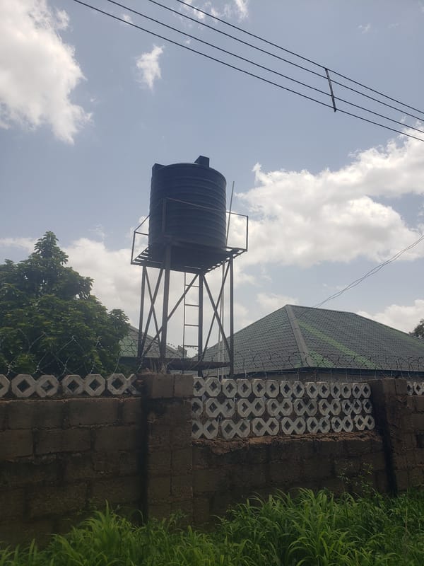 Residential infrastructure: elevated water tank and paved street