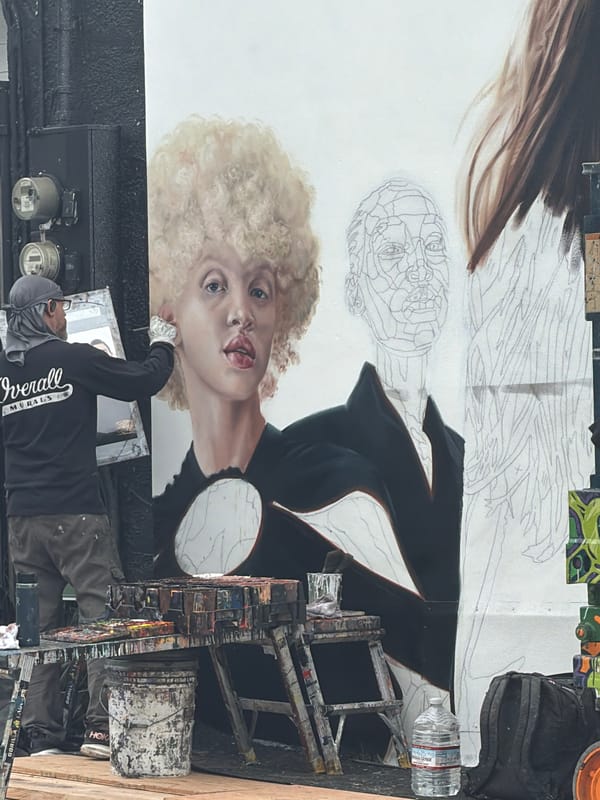 Artist paints woman's portrait mural on Los Angeles building