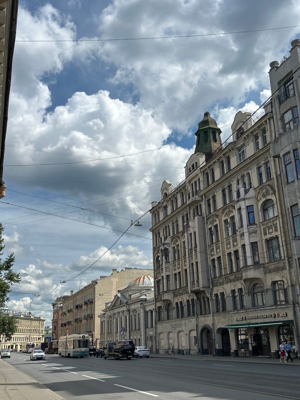 Trams and neoclassical architecture on a city street