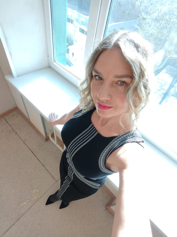 Blonde woman in black dress photographed multiple times indoors