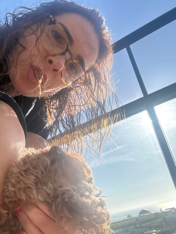 Woman takes morning selfie with dog in Loures