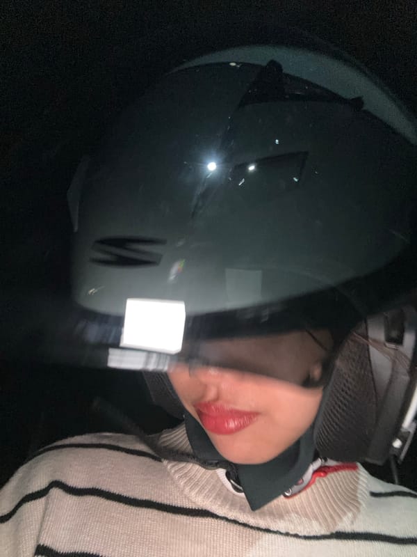 Helmeted figure in striped sweater, Panabo night