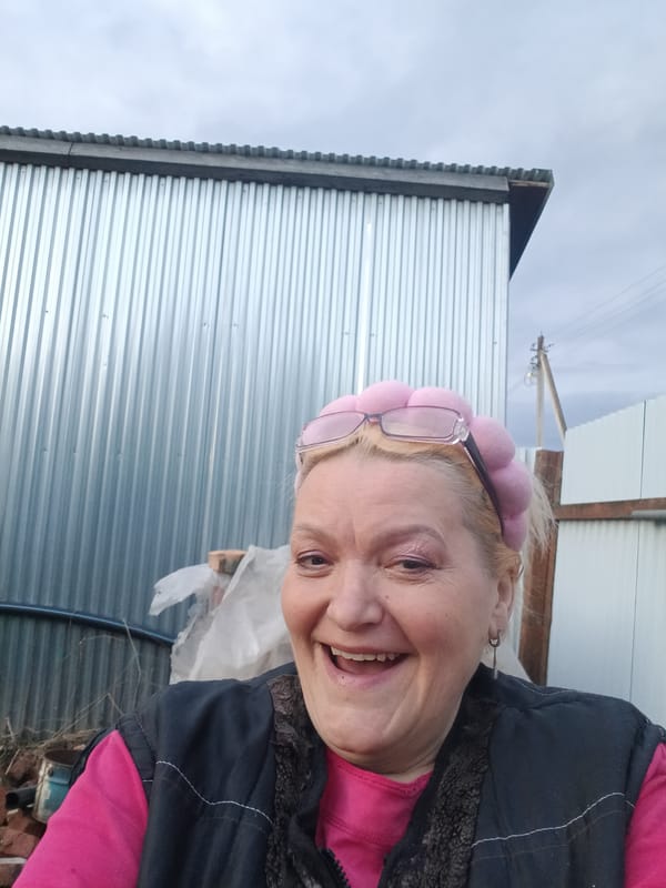 Woman in pink curlers documented in rural Russian village