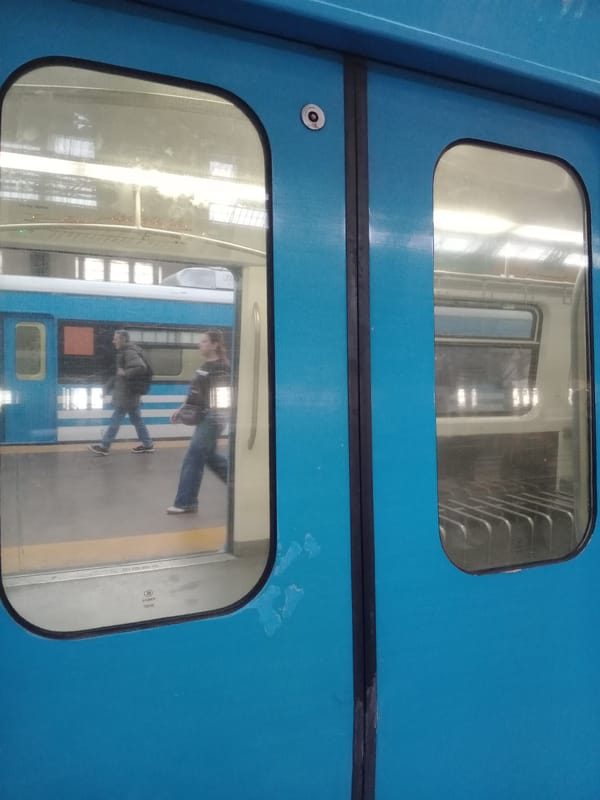 Evening commuter train operations documented at urban transit station