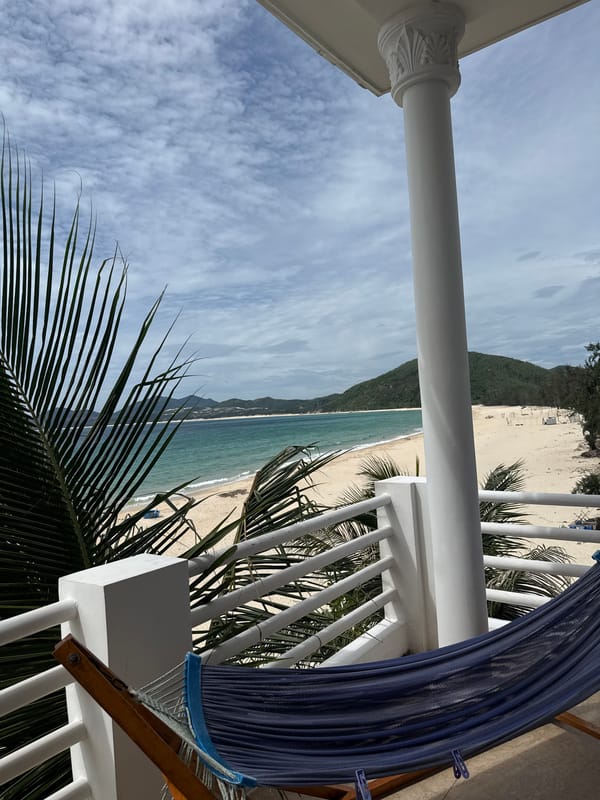 Calm tropical beach and coastline from shore and balcony