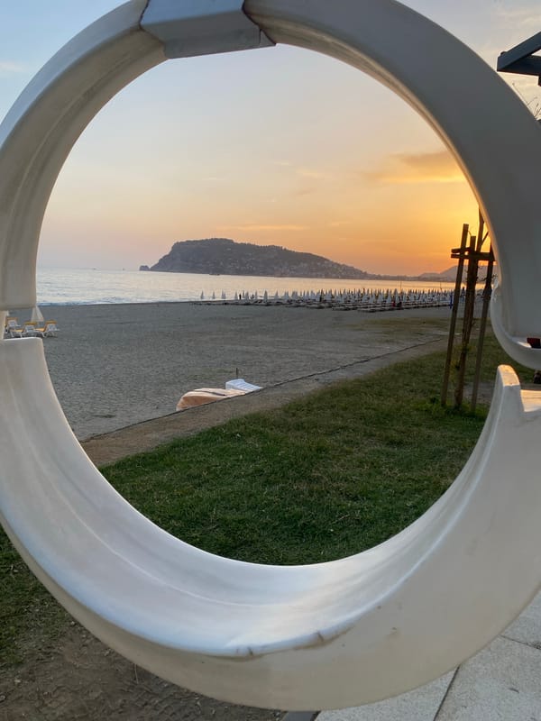 Evening beach life and street performance captured in Alanya