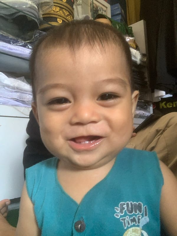 Child photographed multiple times in Sungai Meriam, Indonesia