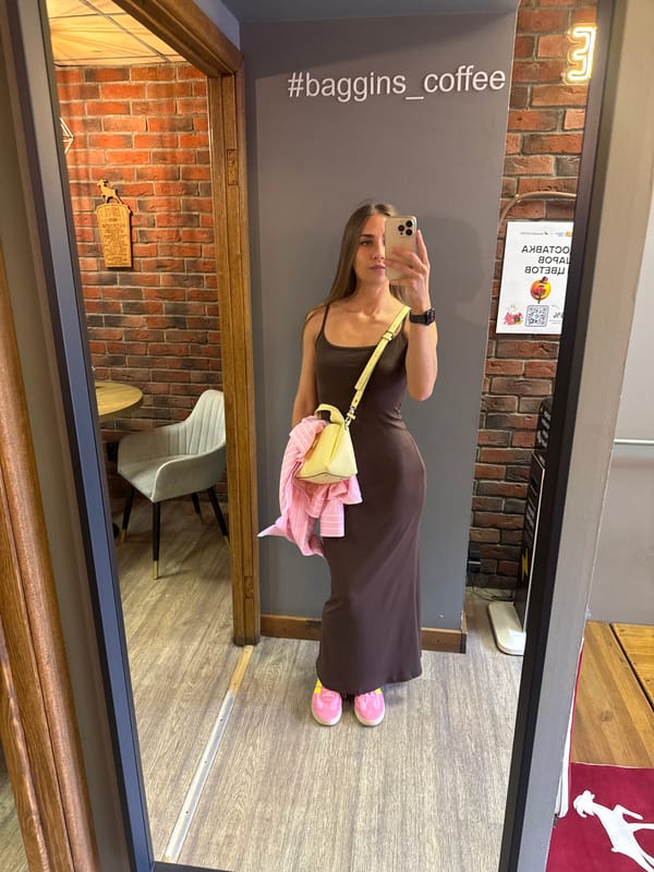 Woman takes mirror selfies at Saint Petersburg cafe