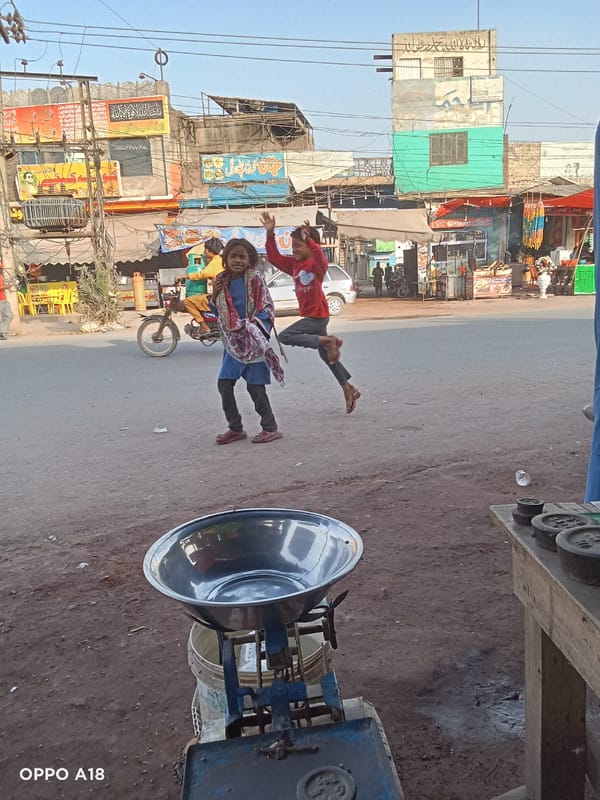 Children play in South Asian street market scene