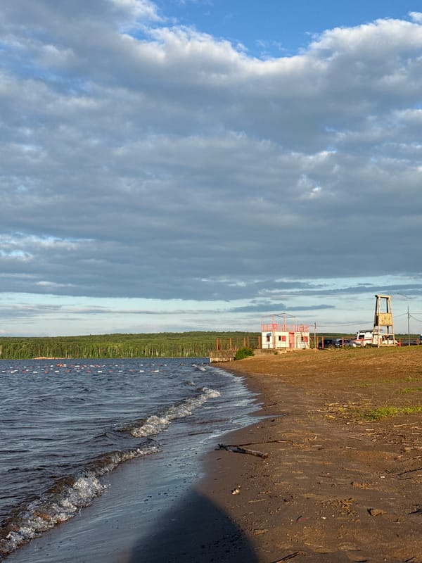 Waves documented breaking on Chaykovsky shoreline under summer skies