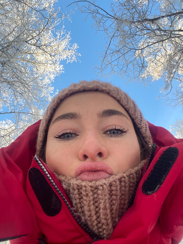 Woman takes winter selfies in sunny Ust-Ilimsk morning