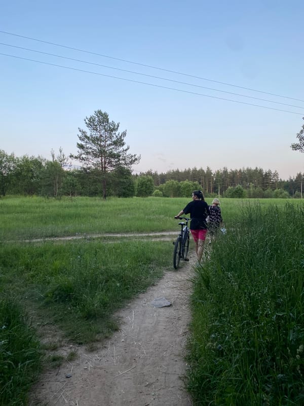 A casual walk along a dirt path through a Minsk-area field.
