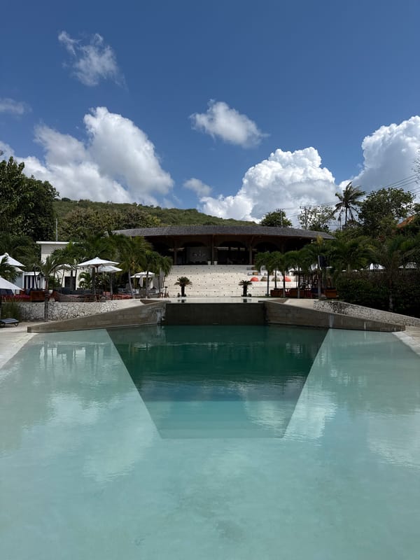 Resort pool and beach swing scene in Nusa Penida