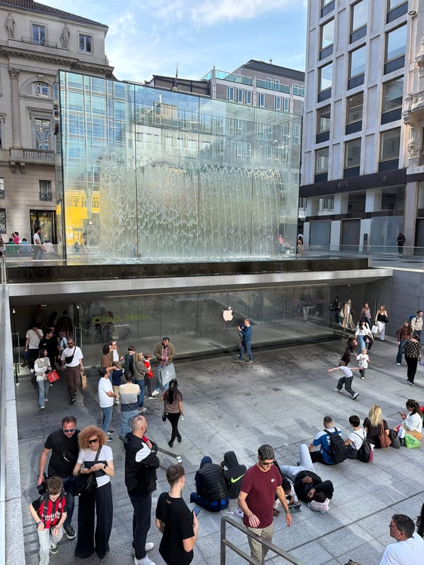 Crowd waits outside Milan Apple Store for product release