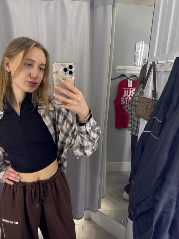 Woman takes fitting room selfies during shopping trip in Bataysk