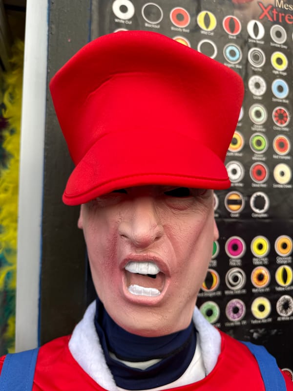 Rubber mask with red cap documented in London