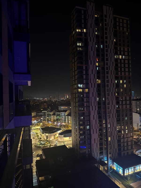 Ümraniye residential complex glowing blue on a summer night