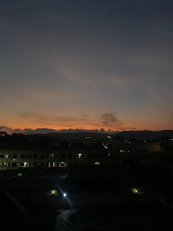 Dusk sky with orange-gray gradient observed over Ratsada, Thailand