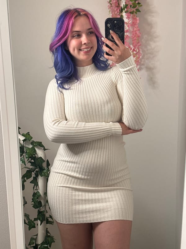 Woman takes colorful hair selfie in Zagreb mirror
