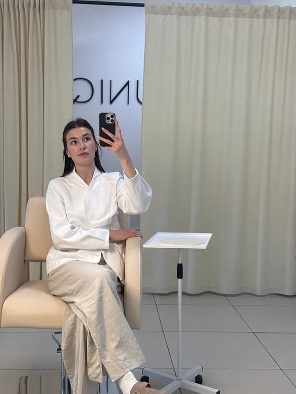 Woman takes selfie in salon chair in Chaikovsky